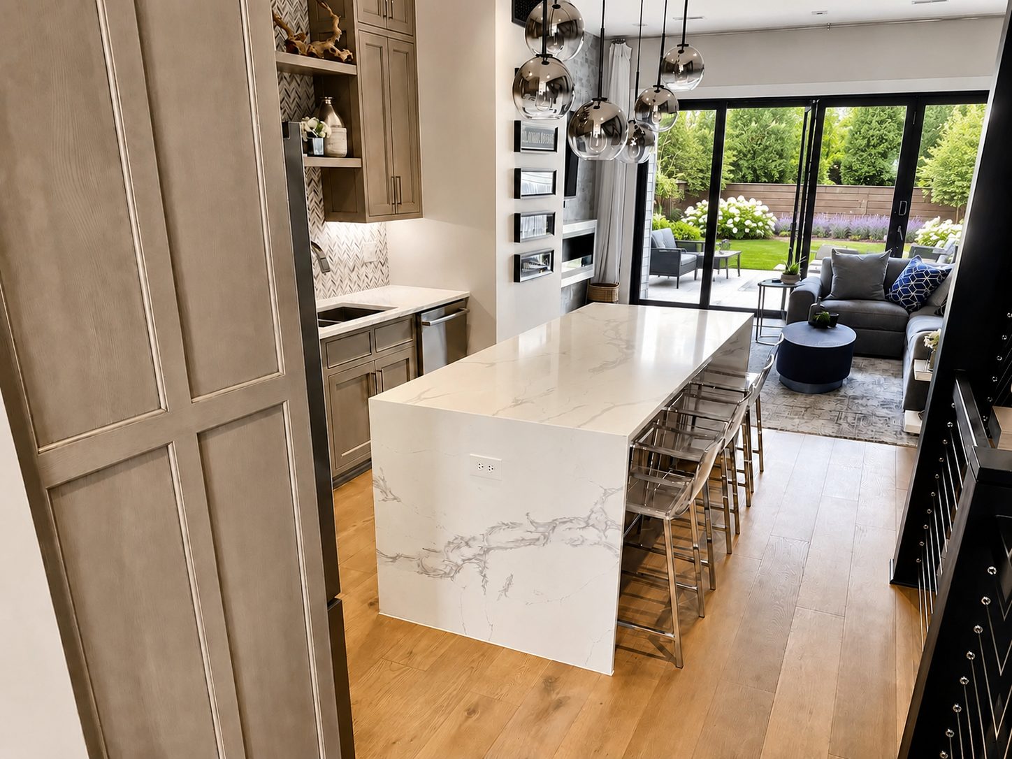 Custom kitchen remodel with marble waterfall island by JCZ Residential in Central Indiana