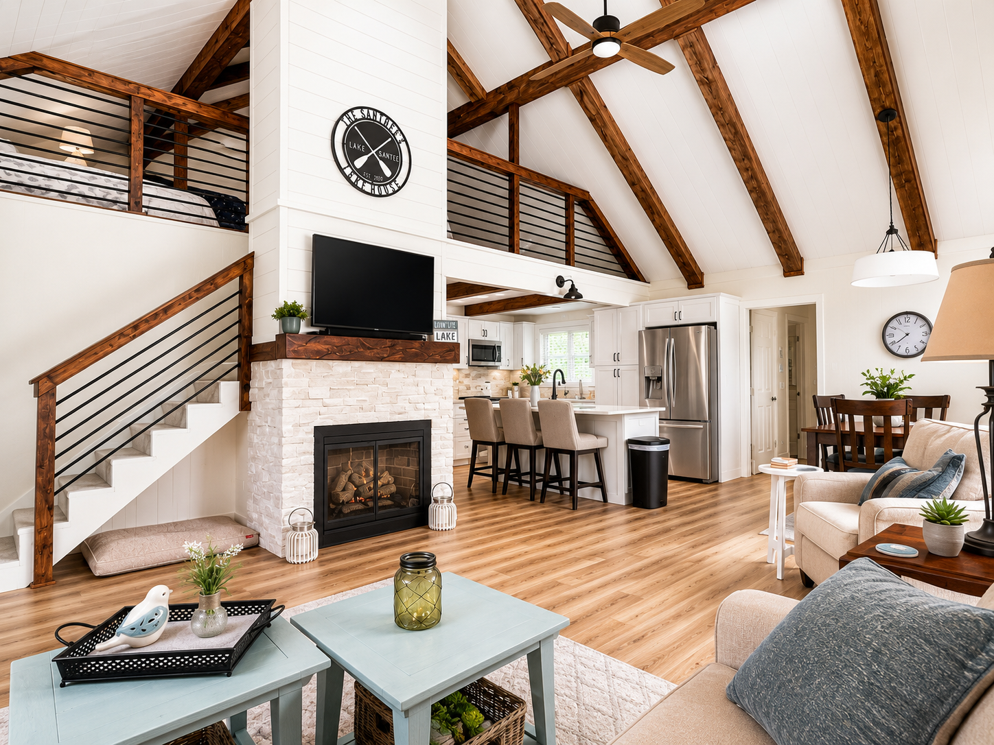 Open lake house living area with exposed wood beams and vaulted ceilings remodeled by JCZ Residential in Greensburg, Indiana
